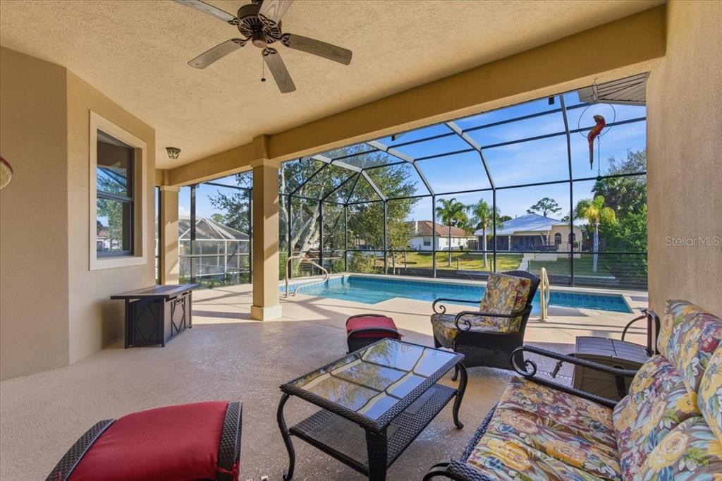 8 Cochran Lane Palm Coast, FL 32137 - Photo 3 of 40 a outdoor space with patio the couches and a dining table with the view of the balcony
