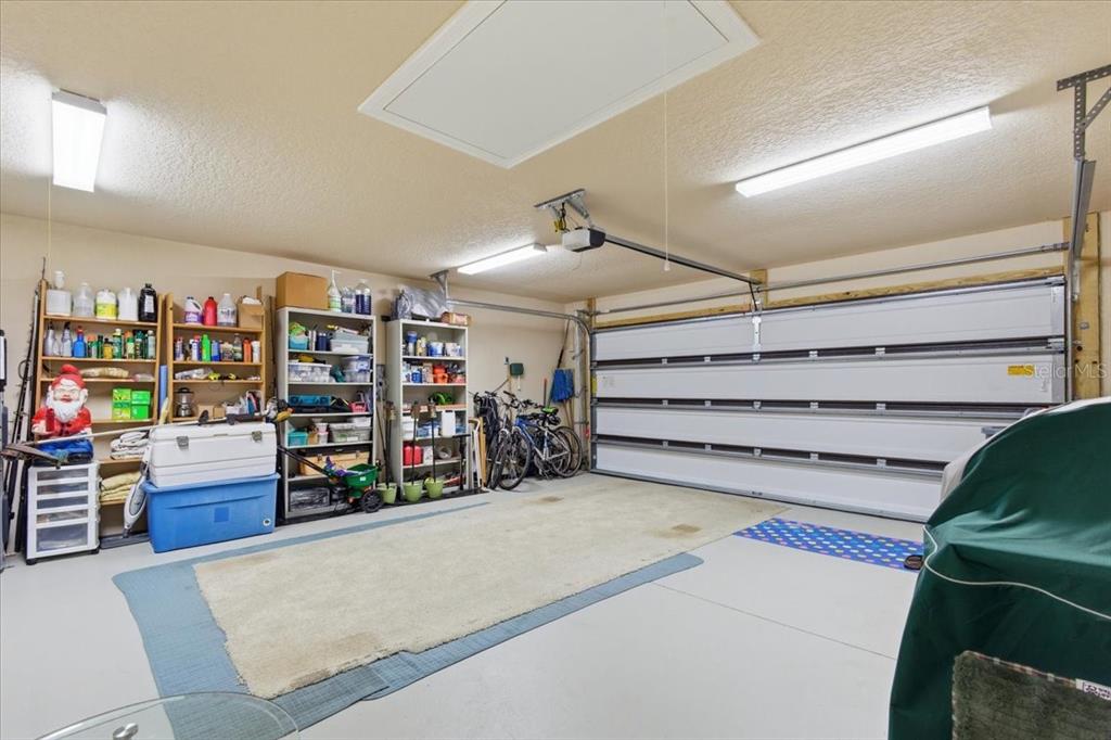 8 Cochran Lane Palm Coast, FL 32137 - Photo 31 of 40 a view of a garage with rack and white cabinet