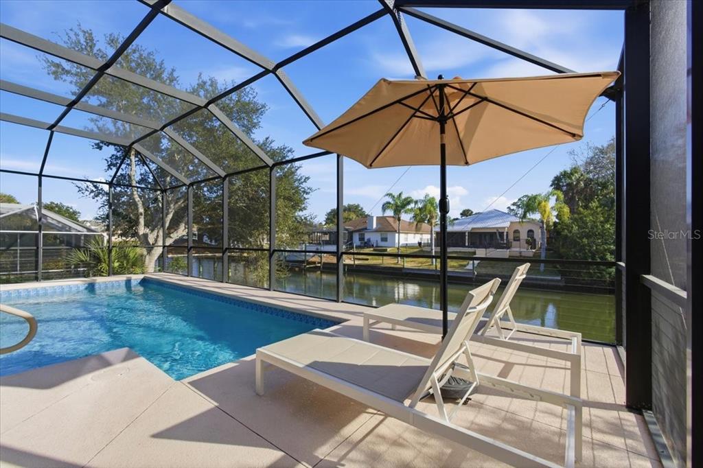 8 Cochran Lane Palm Coast, FL 32137 - Photo 34 of 40 a view of a swimming pool with a patio