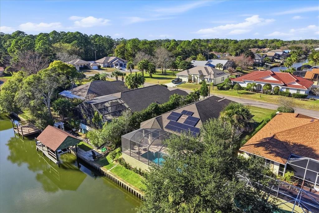 8 Cochran Lane Palm Coast, FL 32137 - Photo 39 of 40 an aerial view of house with yard swimming pool and outdoor seating