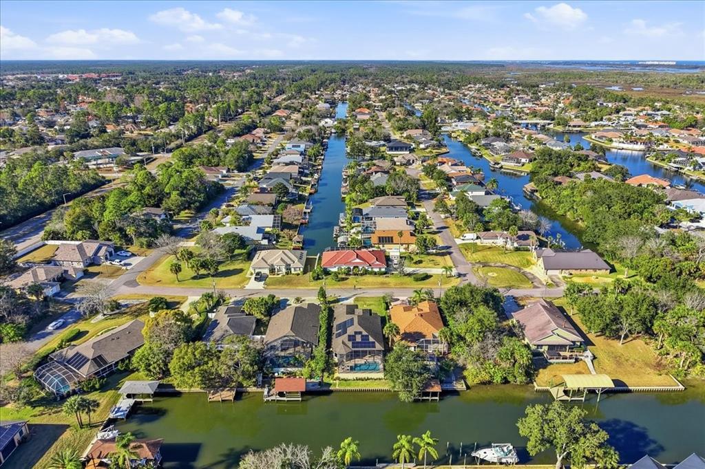 8 Cochran Lane Palm Coast, FL 32137 - Photo 40 of 40 an aerial view of residential houses with outdoor space and trees