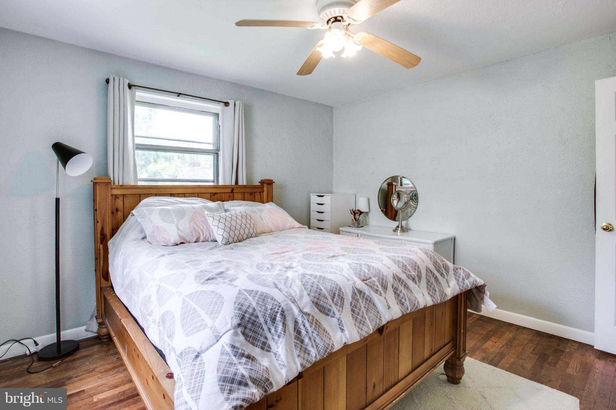 909 Robin Road Silver Spring, MD 20901 - Photo 22 of 39 a bedroom with a bed and window