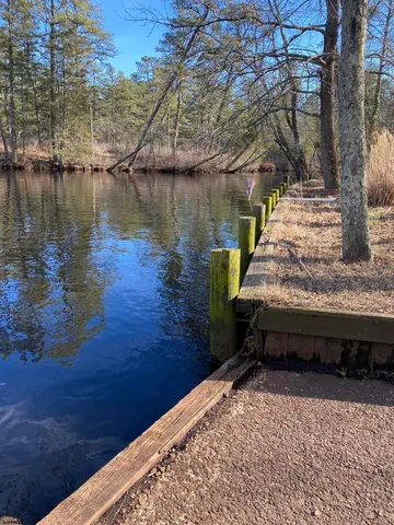 a backyard of a house with outdoor seating