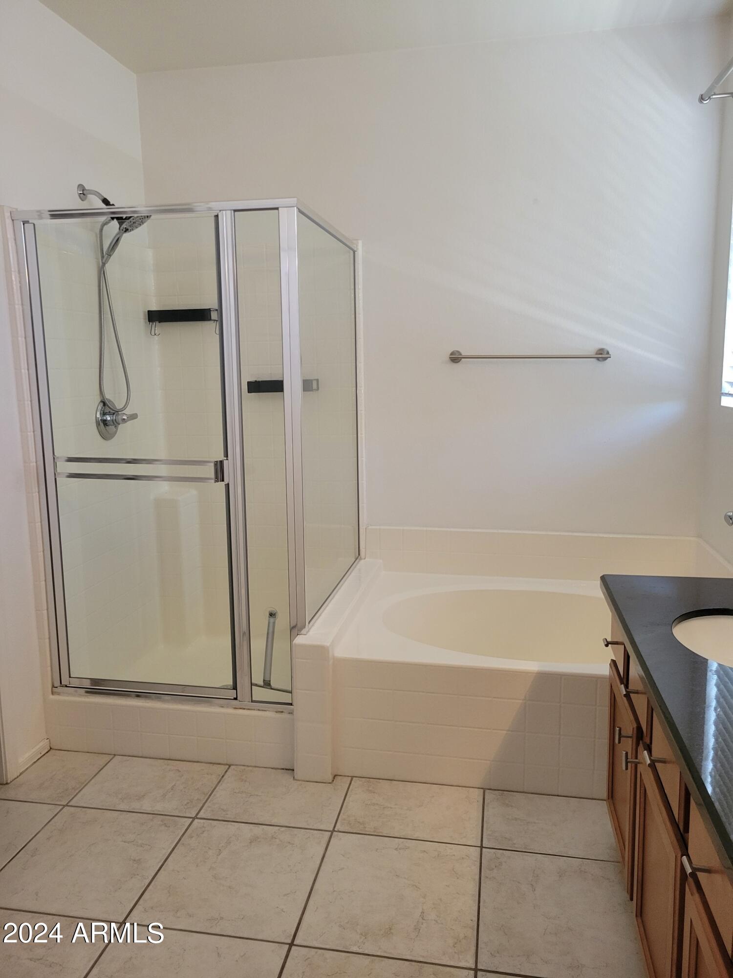 1886 East Don Carlos, Unit 164 Tempe, AZ 85281 - Photo 14 of 24 a bathroom with a bathtub and a shower