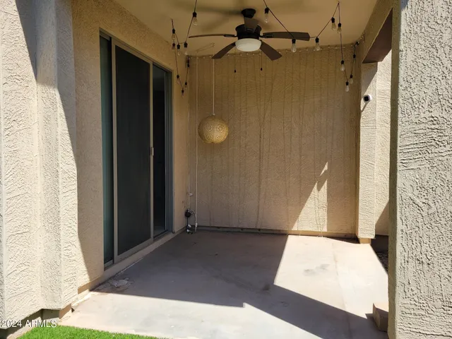 a backyard of a house with seating and yard
