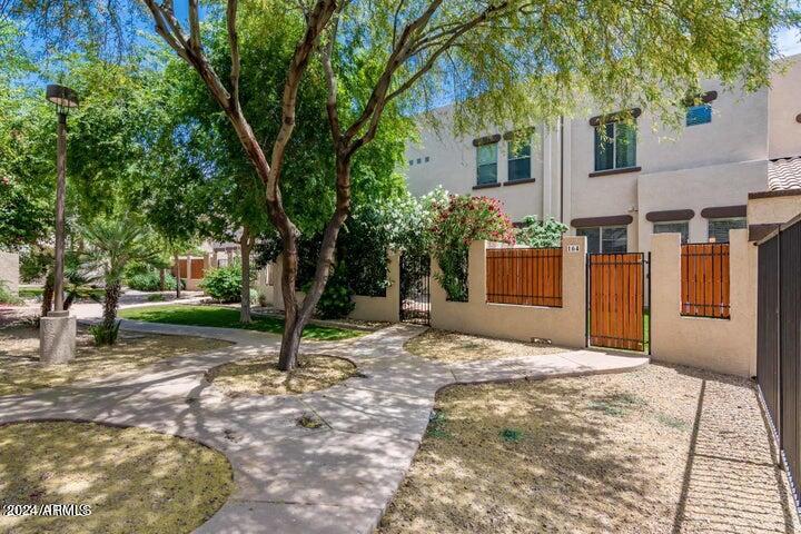 1886 East Don Carlos, Unit 164 Tempe, AZ 85281 - Photo 23 of 24 a view of a house with backyard and trees