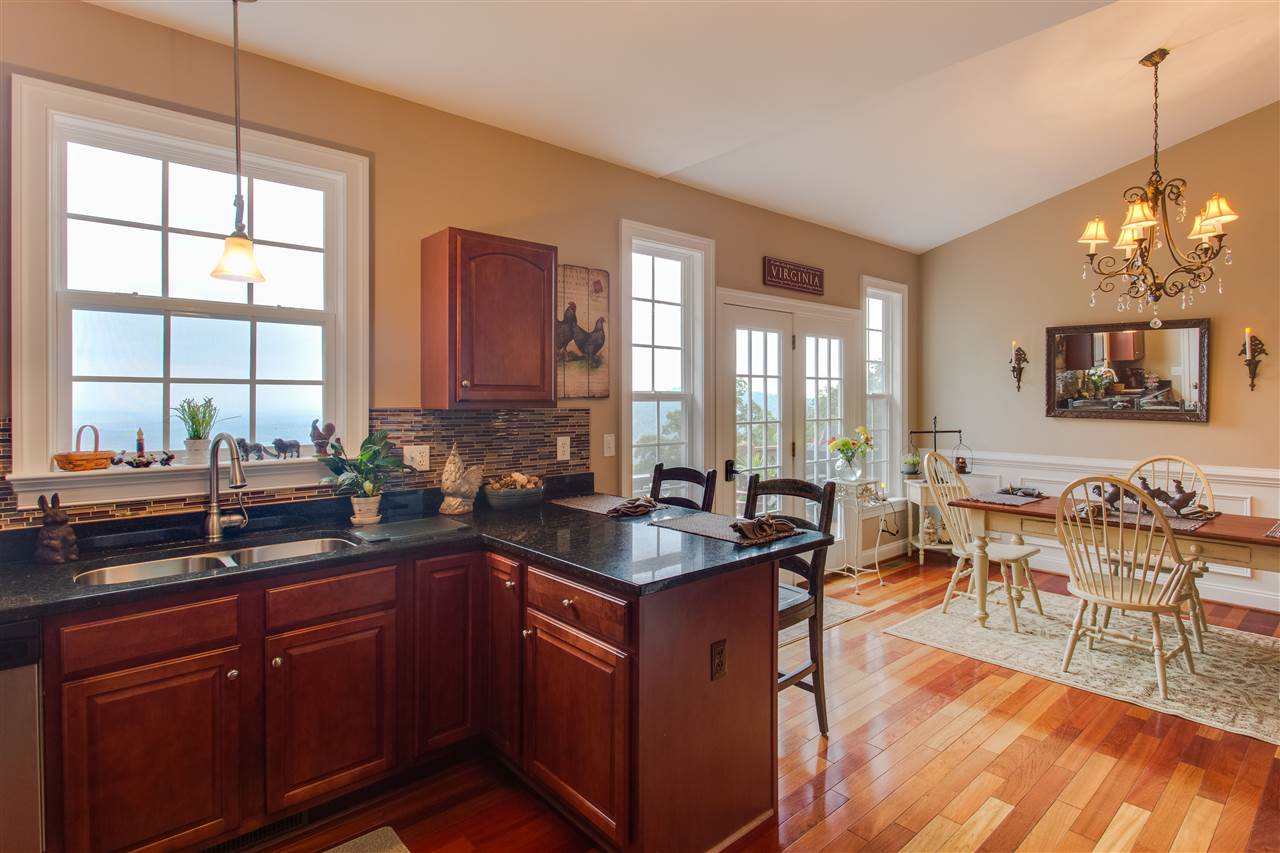 898 Turkey Ridge Road Stanardsville, VA 22973 - Photo 13 of 30 a kitchen with granite countertop a sink stove and cabinets