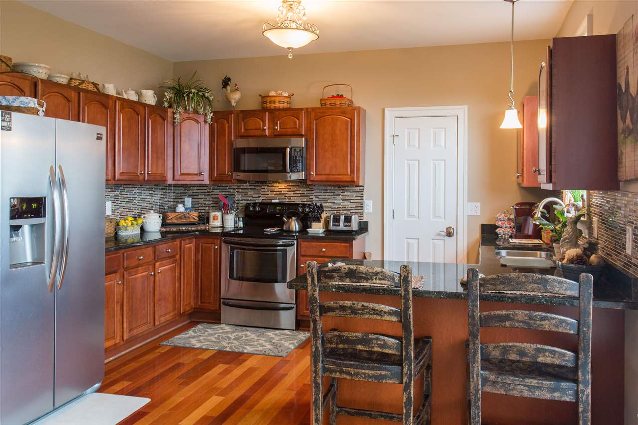 898 Turkey Ridge Road Stanardsville, VA 22973 - Photo 14 of 30 a kitchen with stainless steel appliances a stove a sink and a refrigerator