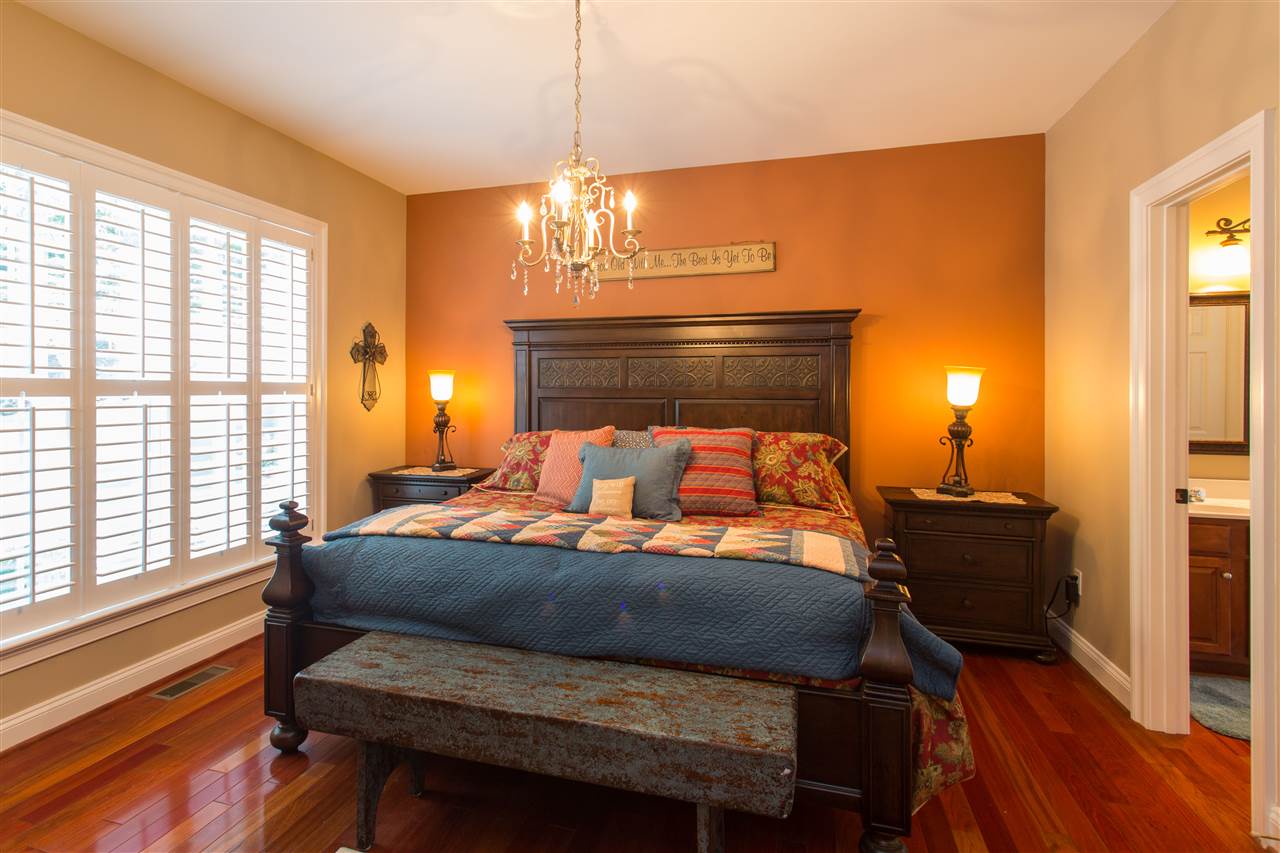 898 Turkey Ridge Road Stanardsville, VA 22973 - Photo 16 of 30 a bedroom with a bed and wooden floor