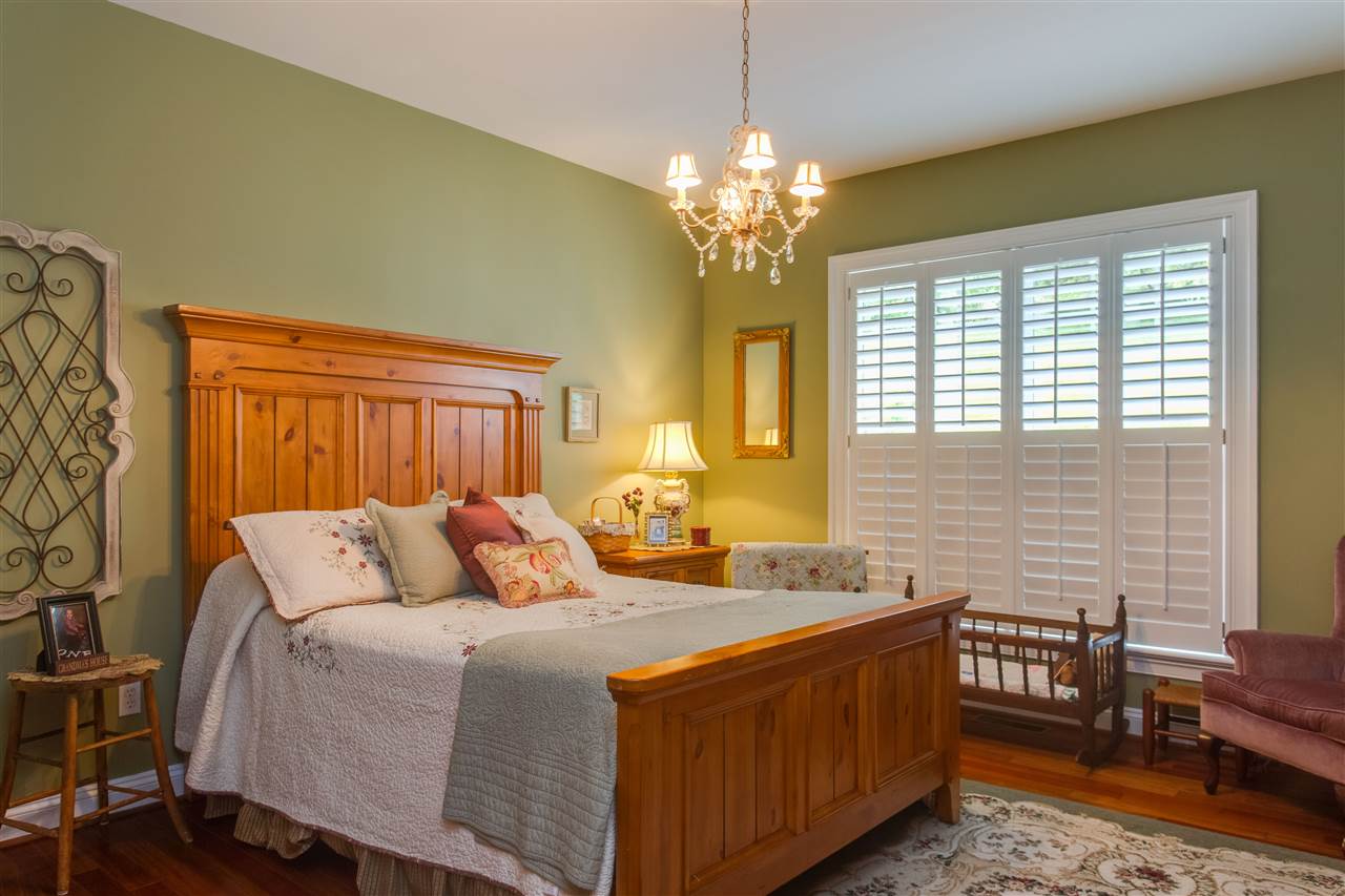 898 Turkey Ridge Road Stanardsville, VA 22973 - Photo 18 of 30 a bedroom with a bed and wooden furniture