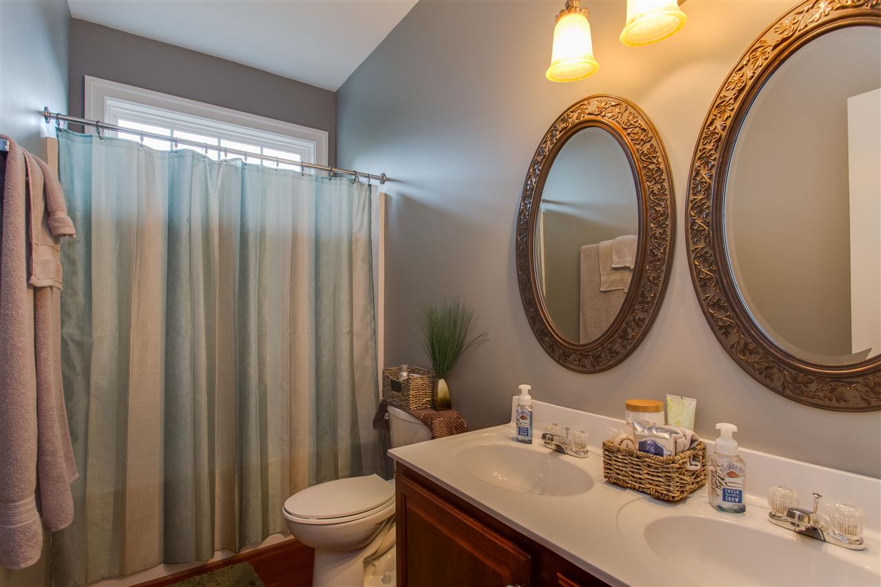 898 Turkey Ridge Road Stanardsville, VA 22973 - Photo 19 of 30 a bathroom with a sink a mirror a toilet and a mirror