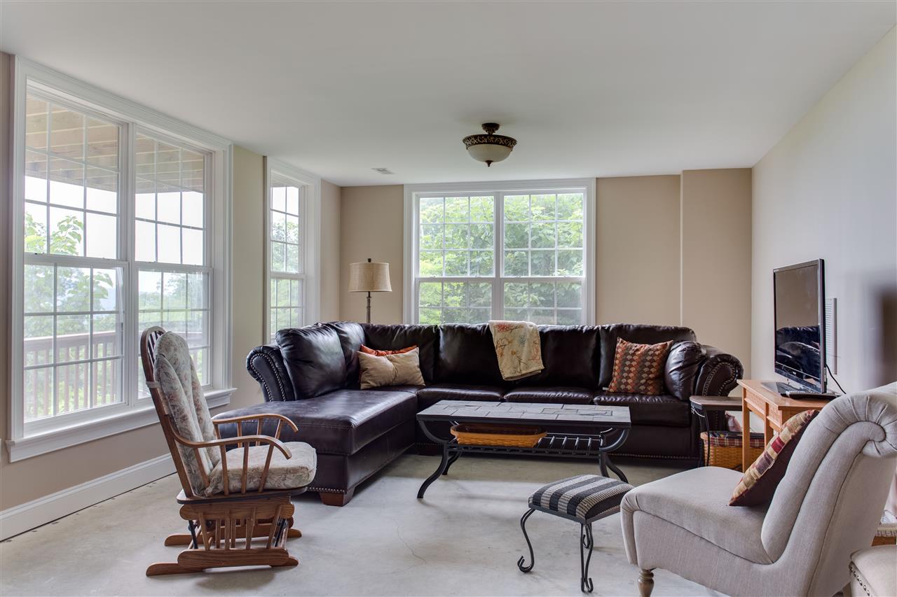 898 Turkey Ridge Road Stanardsville, VA 22973 - Photo 21 of 30 a living room with furniture and a large window