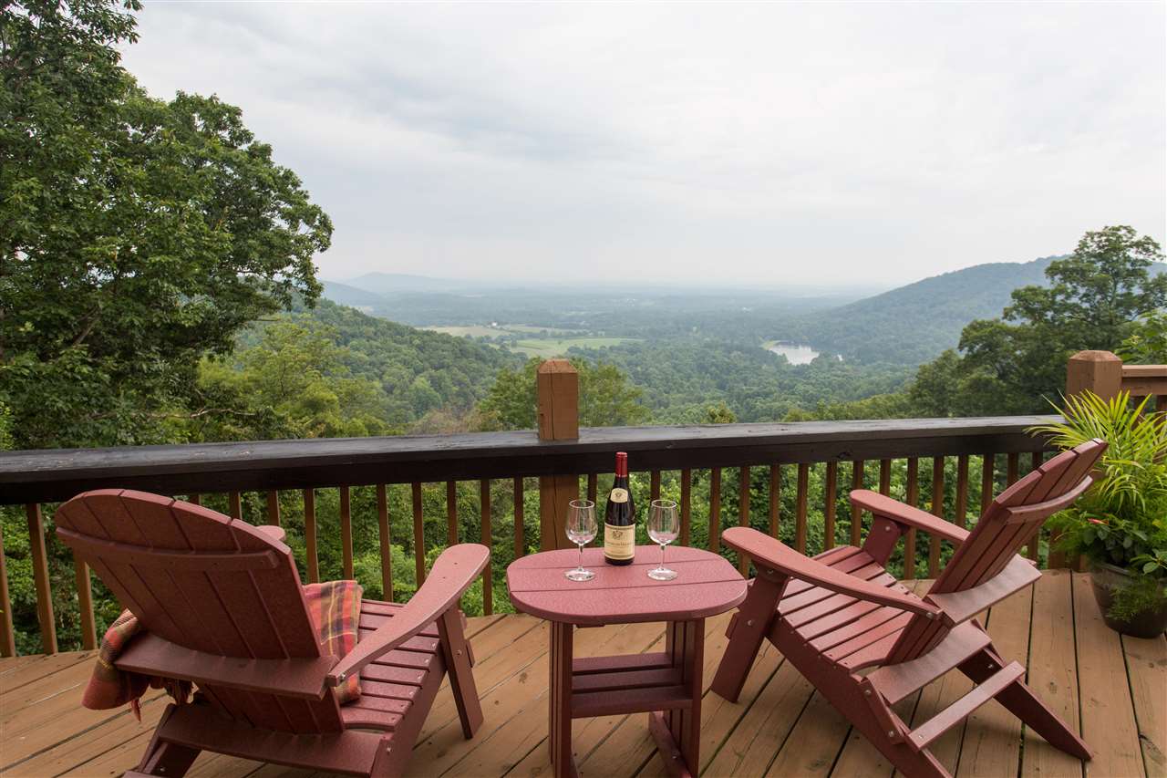 898 Turkey Ridge Road Stanardsville, VA 22973 - Photo 4 of 30 a view of a two chairs in the roof deck