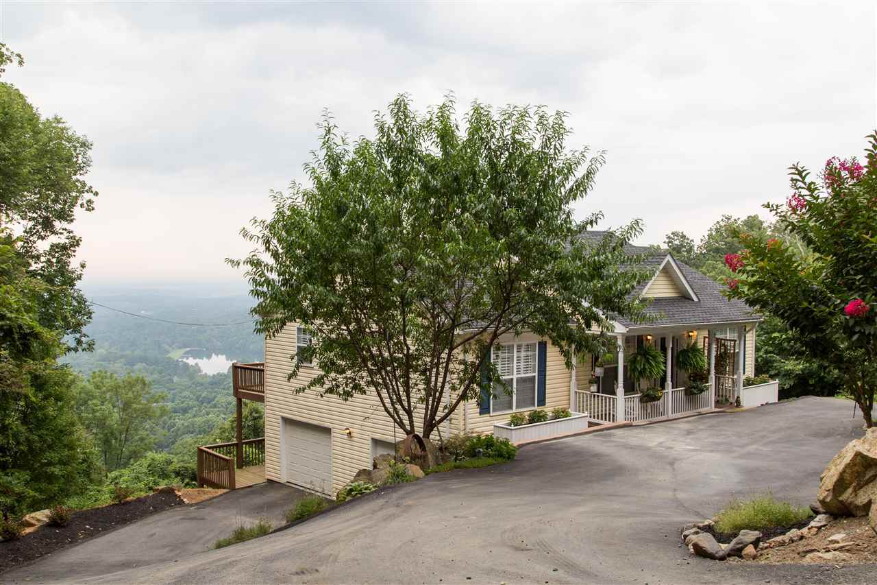 898 Turkey Ridge Road Stanardsville, VA 22973 - Photo 6 of 30 a front view of a house with a yard and garage