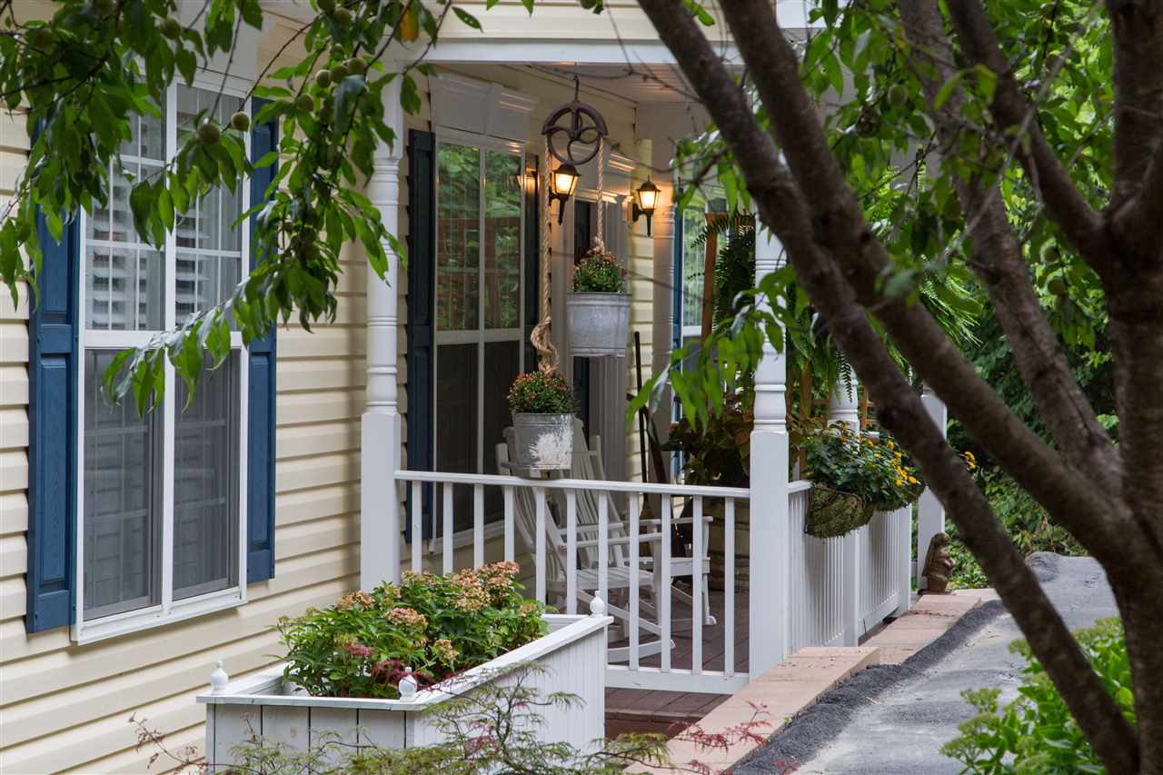 898 Turkey Ridge Road Stanardsville, VA 22973 - Photo 7 of 30 a view of a house with a small yard and potted plants