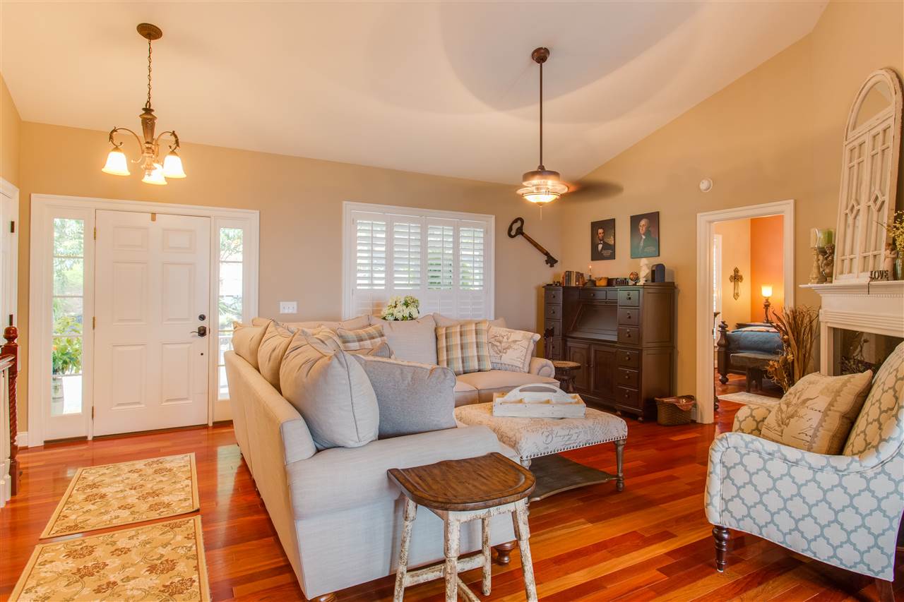 898 Turkey Ridge Road Stanardsville, VA 22973 - Photo 8 of 30 a living room with furniture a dining table and a chandelier