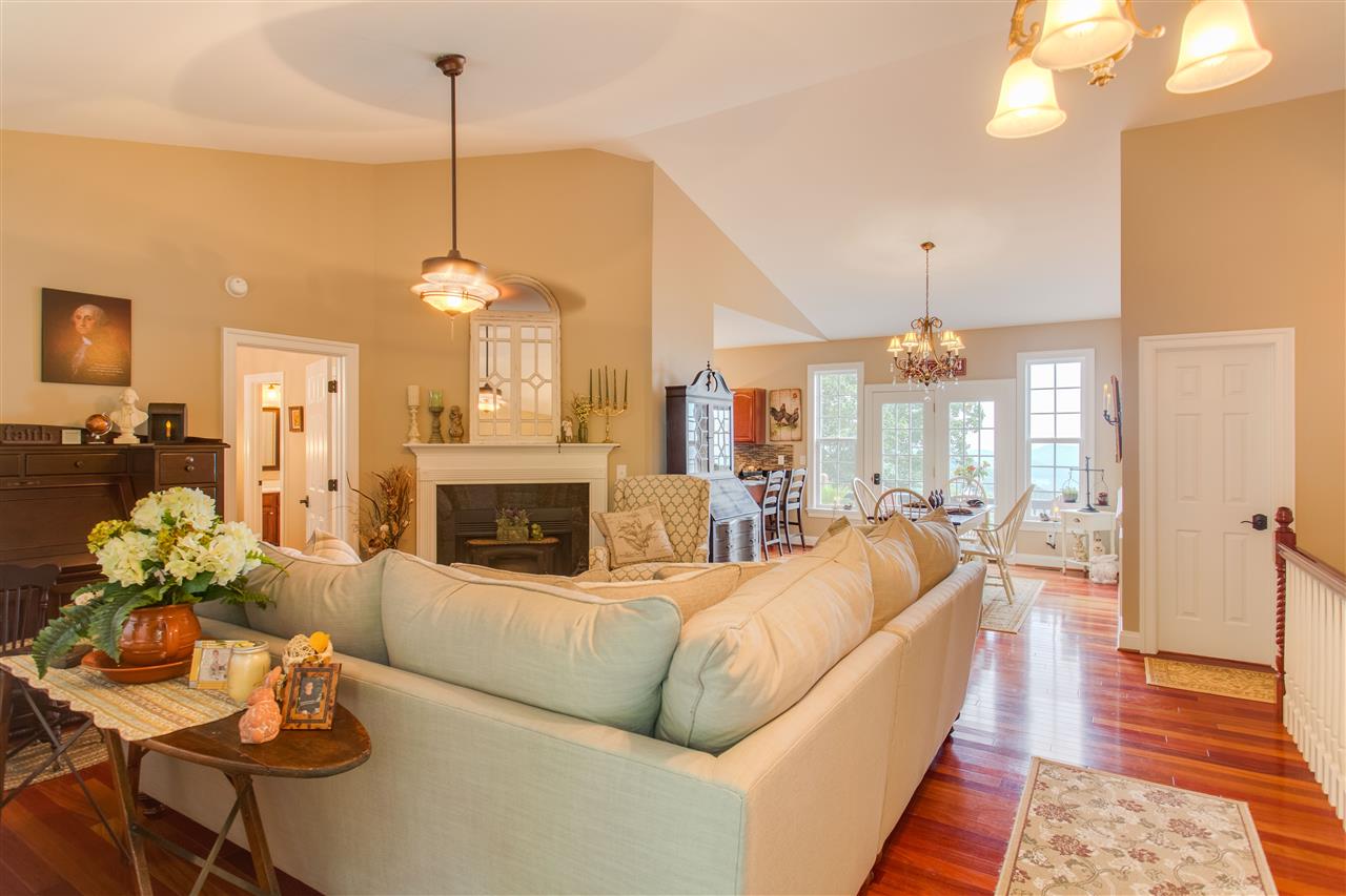 898 Turkey Ridge Road Stanardsville, VA 22973 - Photo 9 of 30 a living room with furniture chandelier and a fireplace
