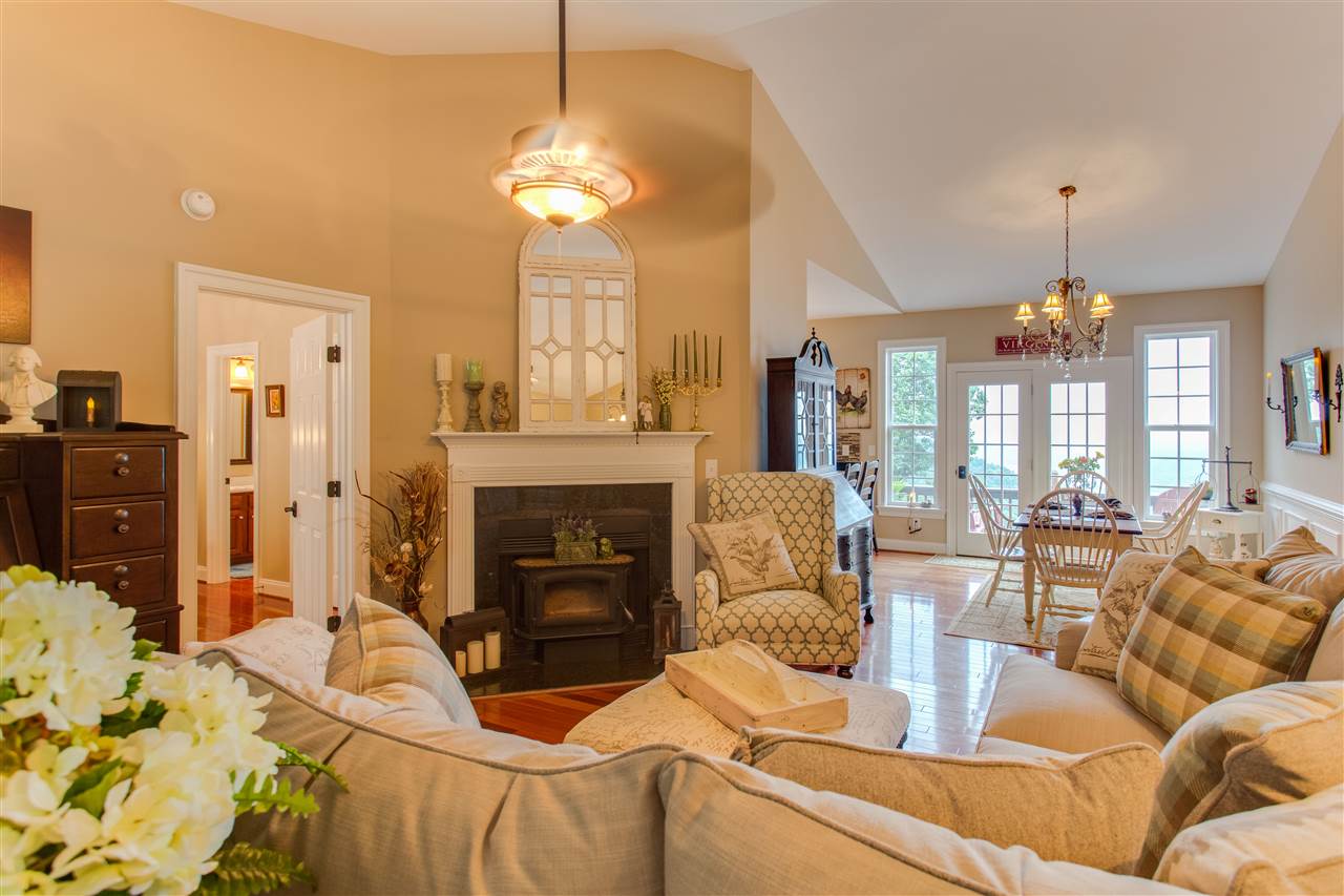 898 Turkey Ridge Road Stanardsville, VA 22973 - Photo 10 of 30 a living room with furniture a chandelier and a fireplace
