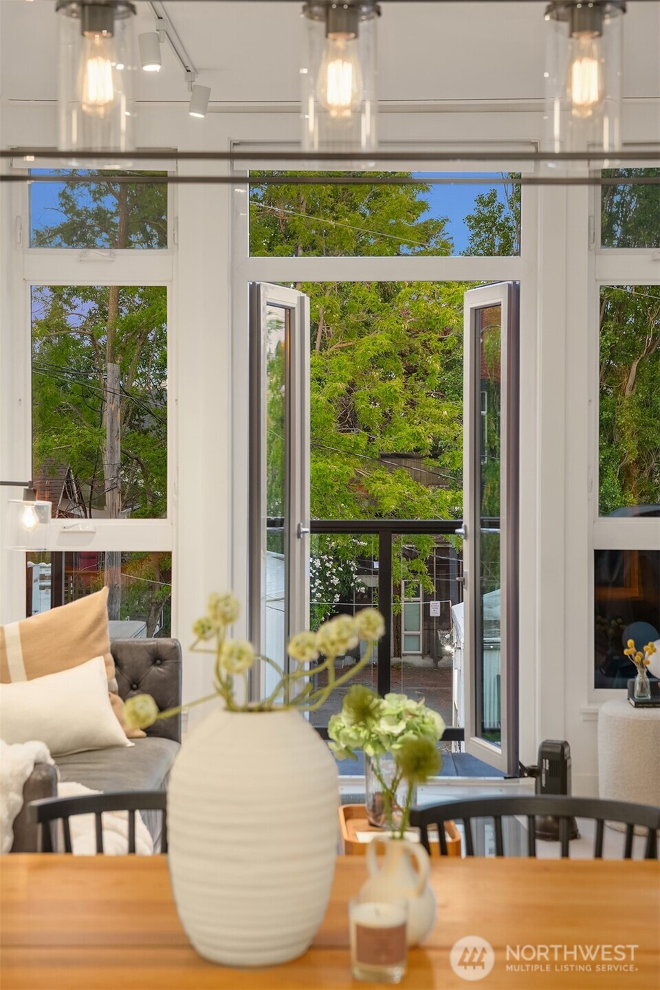 1730 North Northlake Way, Unit 415 Seattle, WA 98103 - Photo 11 of 40 a living room with patio furniture and floor to ceiling windows