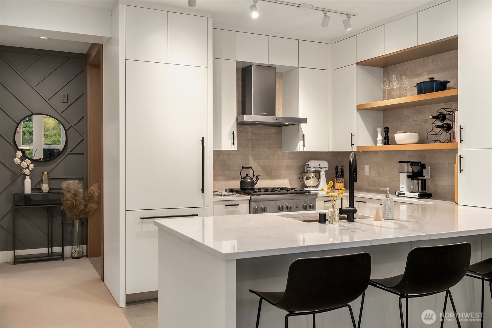 1730 North Northlake Way, Unit 415 Seattle, WA 98103 - Photo 2 of 40 a kitchen with stainless steel appliances a sink and cabinets
