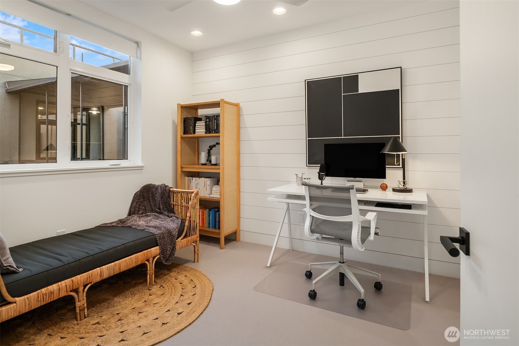 1730 North Northlake Way, Unit 415 Seattle, WA 98103 - Photo 29 of 40 a living room with furniture and a flat screen tv