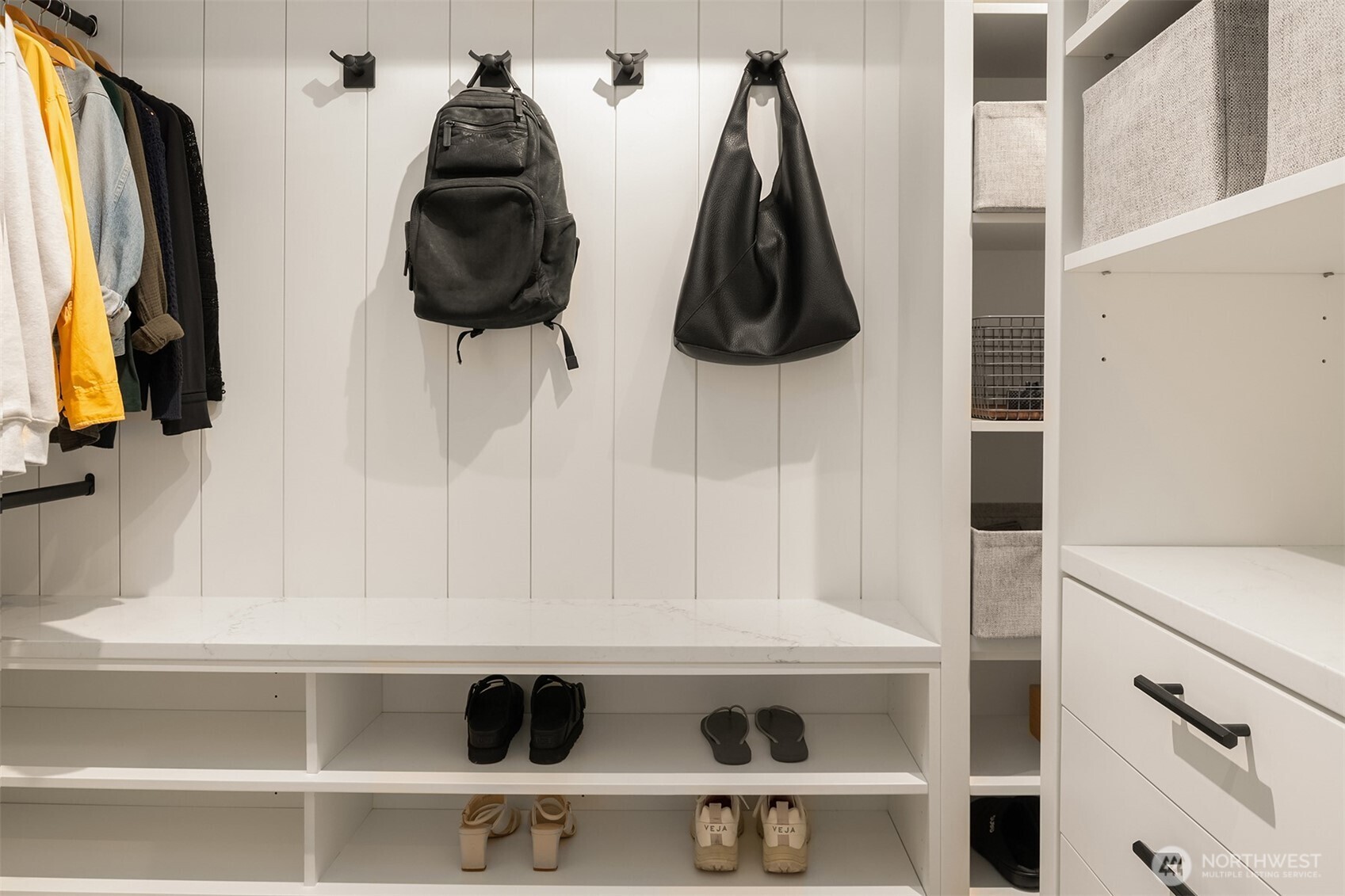 1730 North Northlake Way, Unit 415 Seattle, WA 98103 - Photo 31 of 40 a view of walk in closet with clothes and shoes