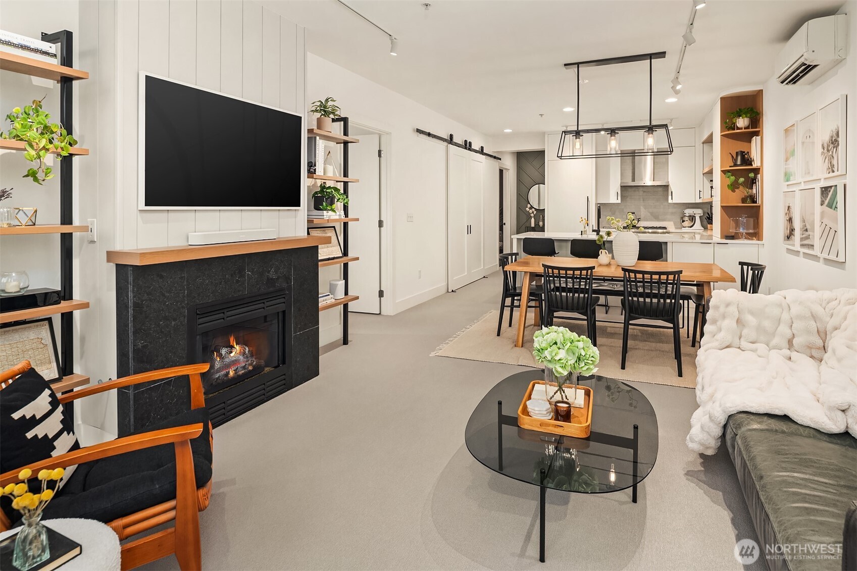 1730 North Northlake Way, Unit 415 Seattle, WA 98103 - Photo 9 of 40 a living room with furniture and a flat screen tv