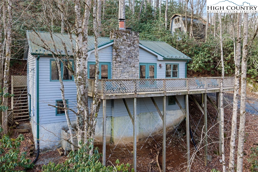 131 Hemlock Road Banner Elk, NC 28604 - Photo 1 of 37 a aerial view of a house with balcony
