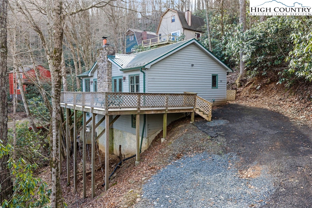 131 Hemlock Road Banner Elk, NC 28604 - Photo 2 of 37 a view of a house with backyard and balcony
