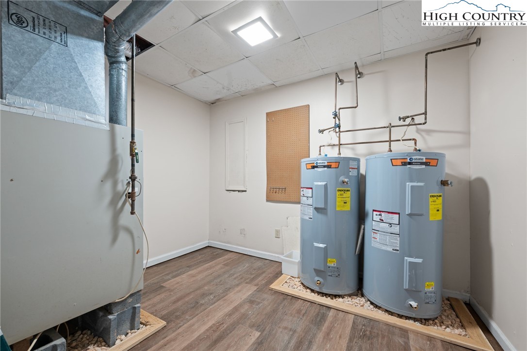 131 Hemlock Road Banner Elk, NC 28604 - Photo 25 of 37 a view of storage and utility room with a washer dryer and wooden floor