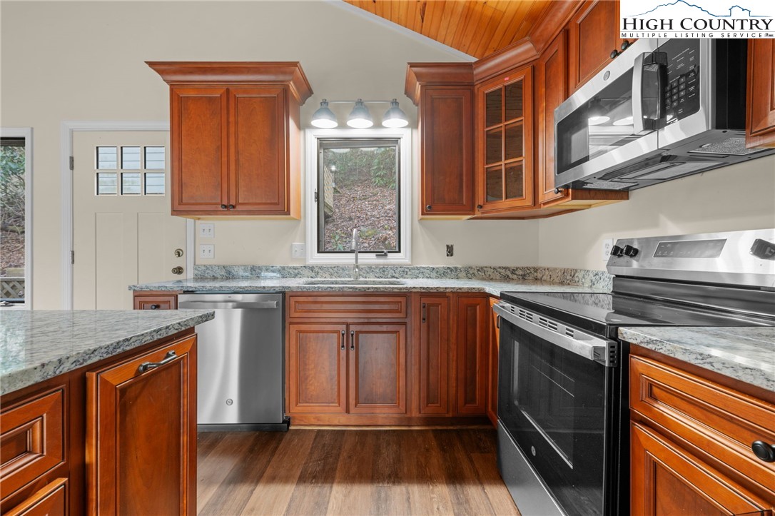 131 Hemlock Road Banner Elk, NC 28604 - Photo 8 of 37 a kitchen with stainless steel appliances granite countertop a stove and a sink