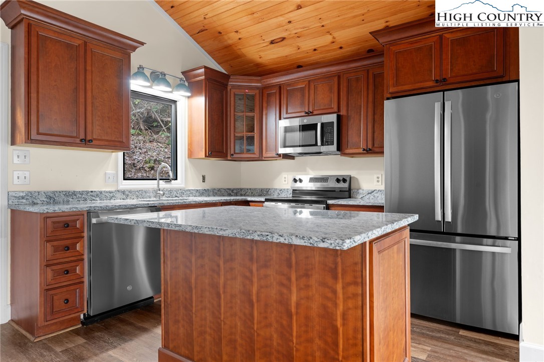 131 Hemlock Road Banner Elk, NC 28604 - Photo 9 of 37 a kitchen with stainless steel appliances granite countertop a refrigerator stove and sink