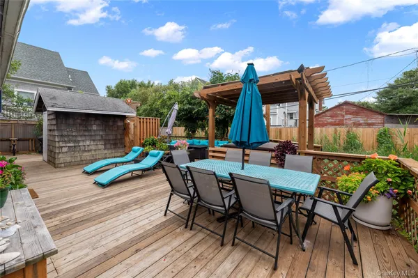 a view of outdoor dining space with a table and chairs