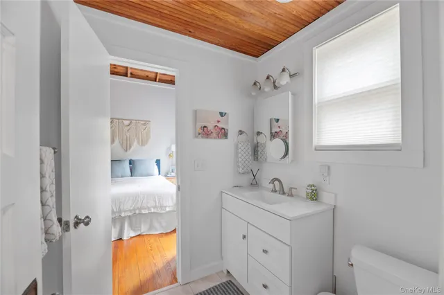 a bedroom with a bed and a book shelf