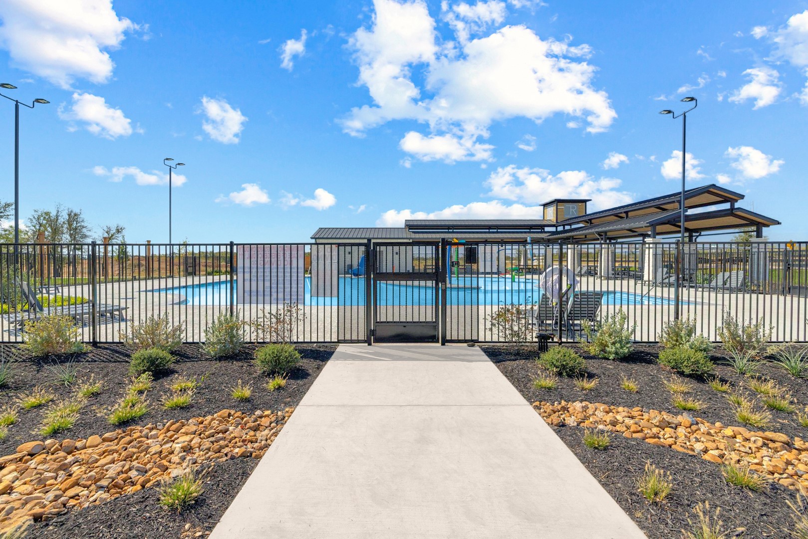 190 Hornet Street Elgin, TX 78621 - Photo 2 of 40 a view of a house with backyard sitting area and garden