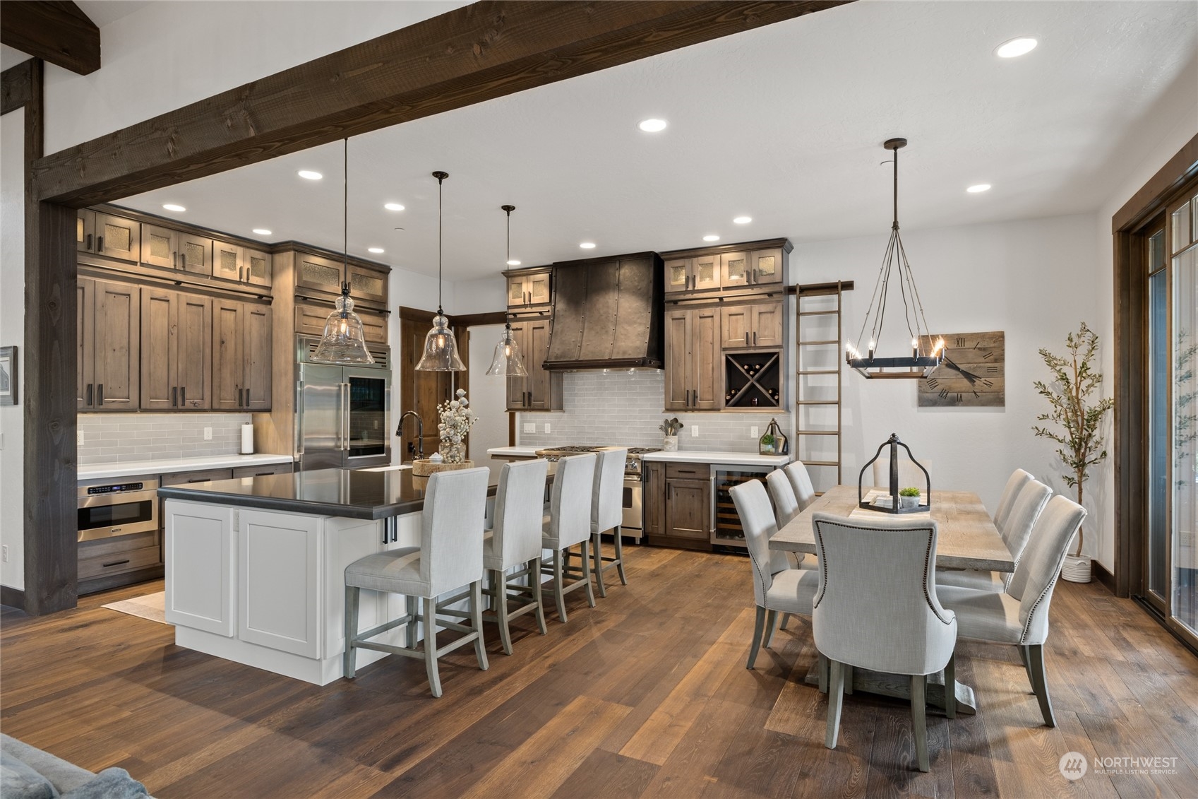 351 Maple Leaf Loop Cle Elum, WA 98922 - Photo 10 of 40 a kitchen with stainless steel appliances kitchen island granite countertop a dining table chairs and sink