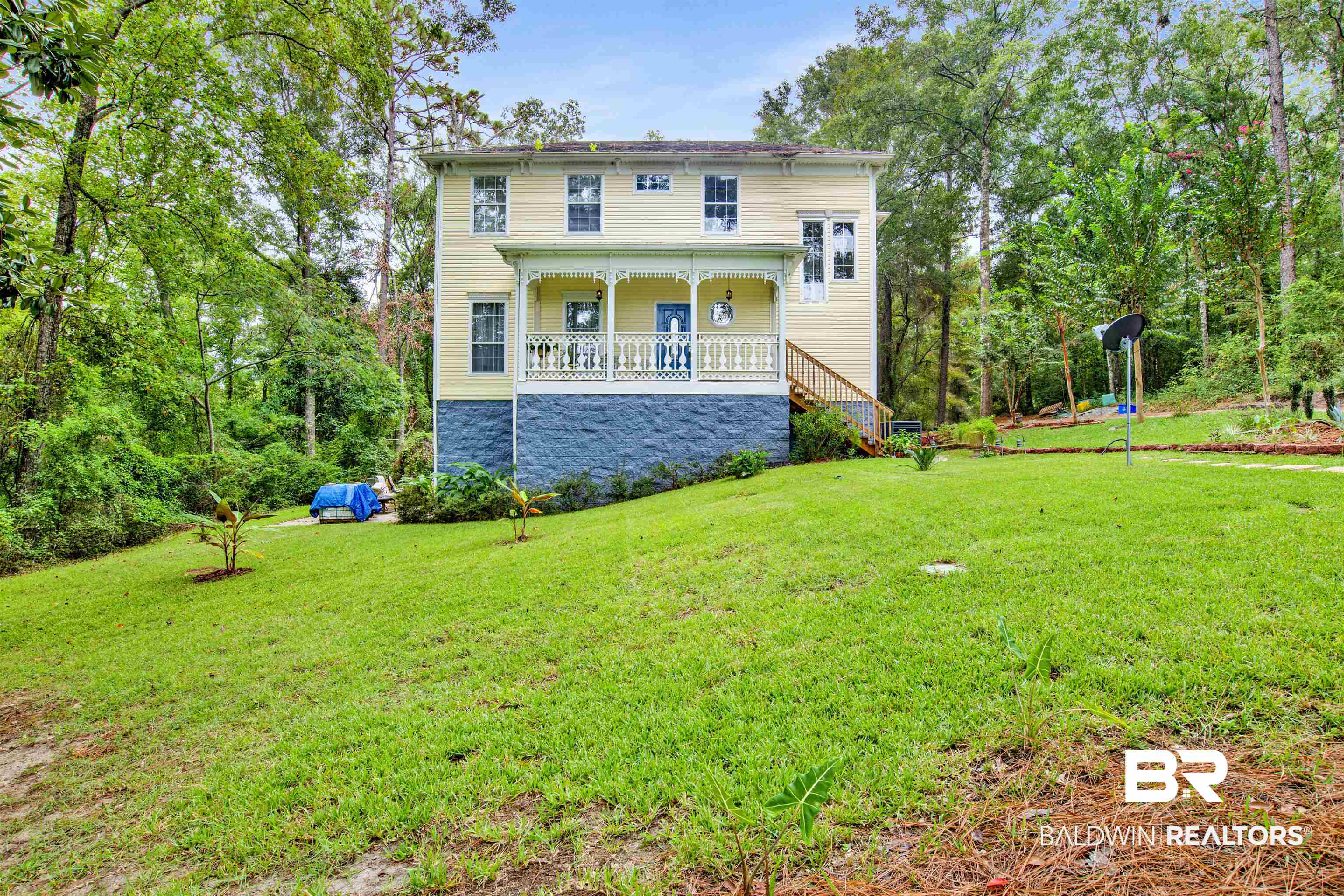 7641 Hitt Road Mobile, AL 36695 - Photo 2 of 29 Back of property featuring a yard and covered porch