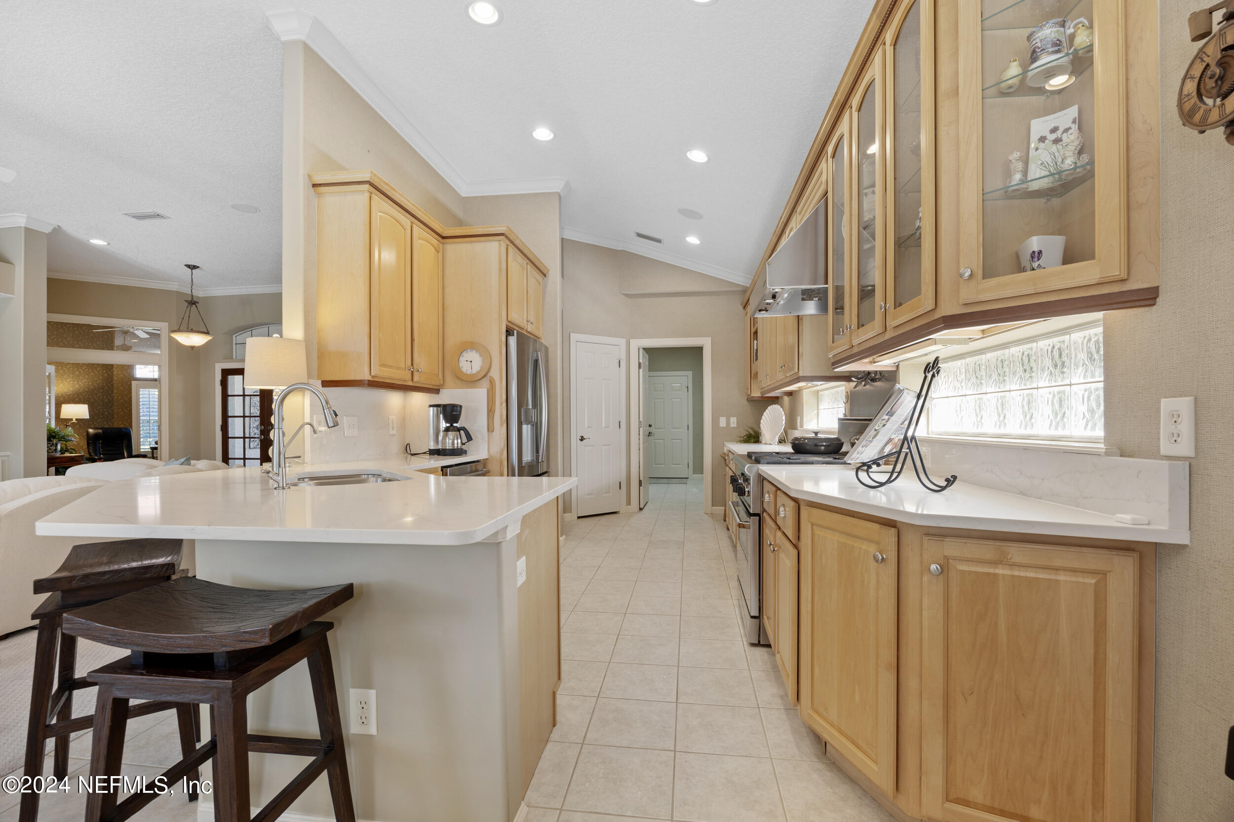 348 Fiddlers Point Drive St. Augustine, FL 32080 - Photo 12 of 58 a kitchen with stainless steel appliances granite countertop a sink and cabinets