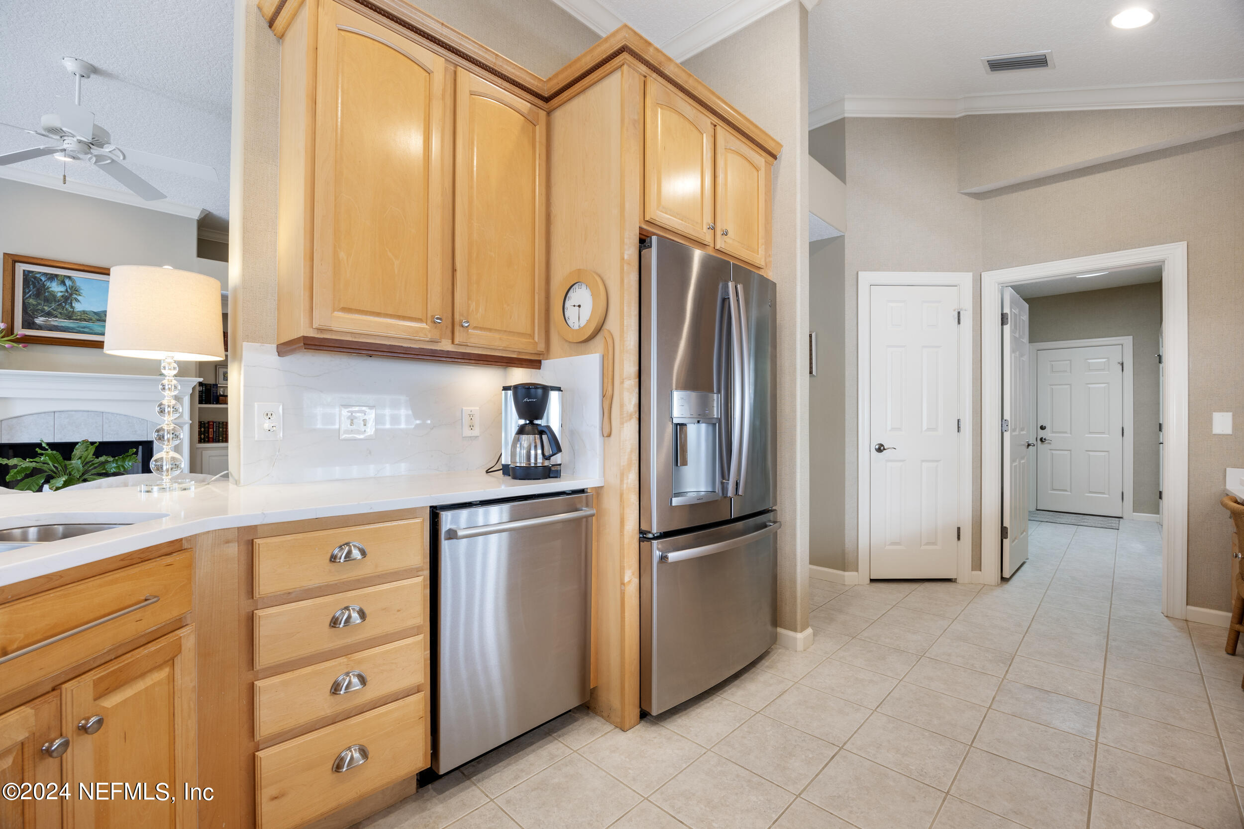 348 Fiddlers Point Drive St. Augustine, FL 32080 - Photo 14 of 58 a kitchen with stainless steel appliances granite countertop a refrigerator and cabinets