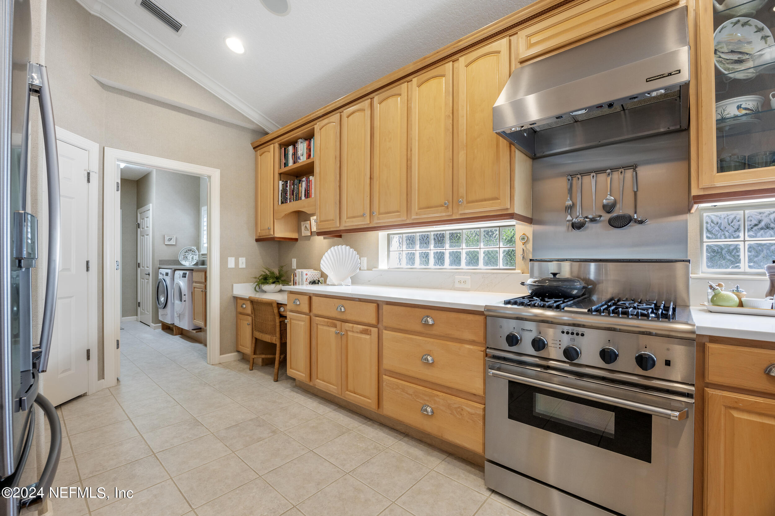 348 Fiddlers Point Drive St. Augustine, FL 32080 - Photo 15 of 58 a kitchen with stainless steel appliances a stove a sink and cabinets