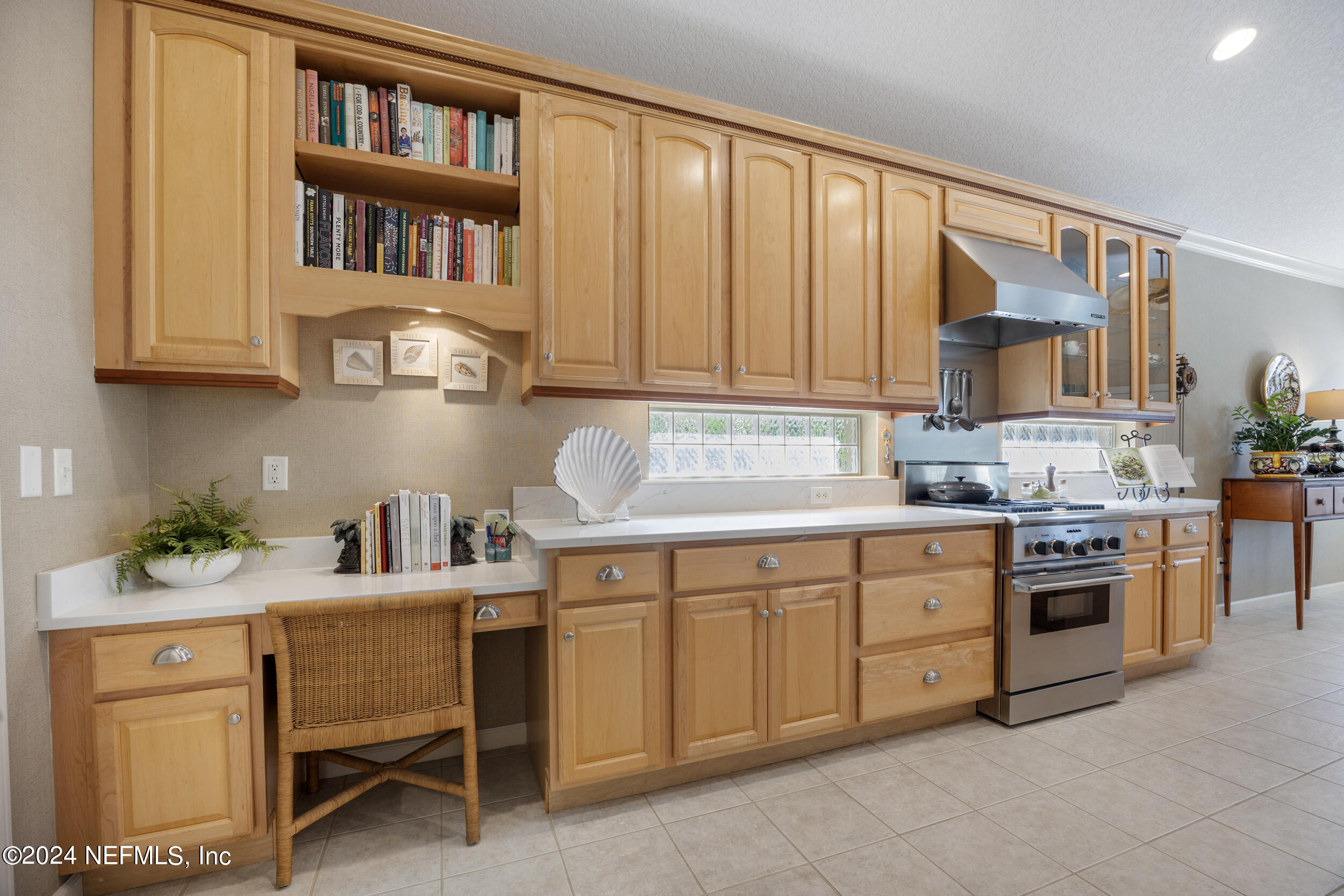 348 Fiddlers Point Drive St. Augustine, FL 32080 - Photo 16 of 58 a kitchen with a stove cabinets and a window