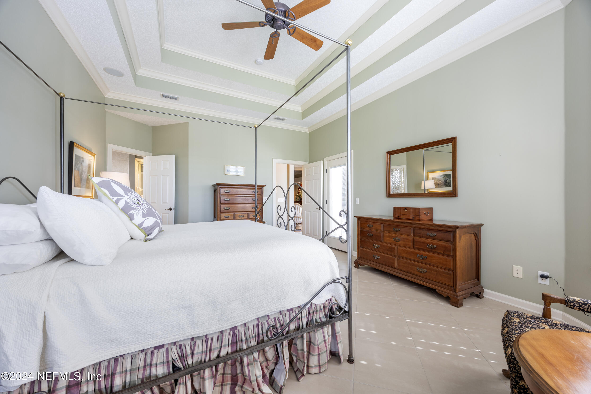 348 Fiddlers Point Drive St. Augustine, FL 32080 - Photo 23 of 58 a bedroom with a bed and a dresser