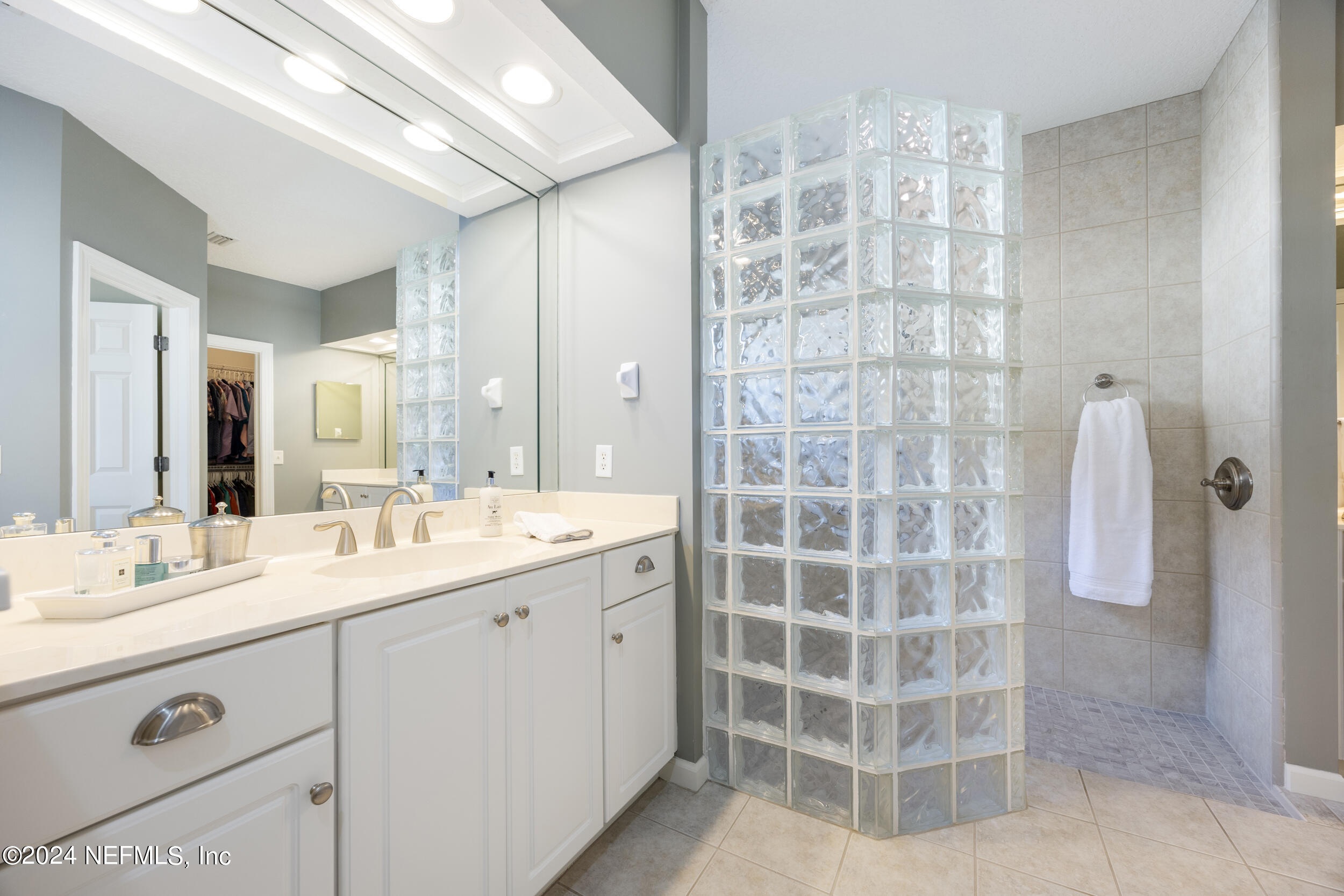 348 Fiddlers Point Drive St. Augustine, FL 32080 - Photo 26 of 58 a bathroom with a double vanity sink mirror and