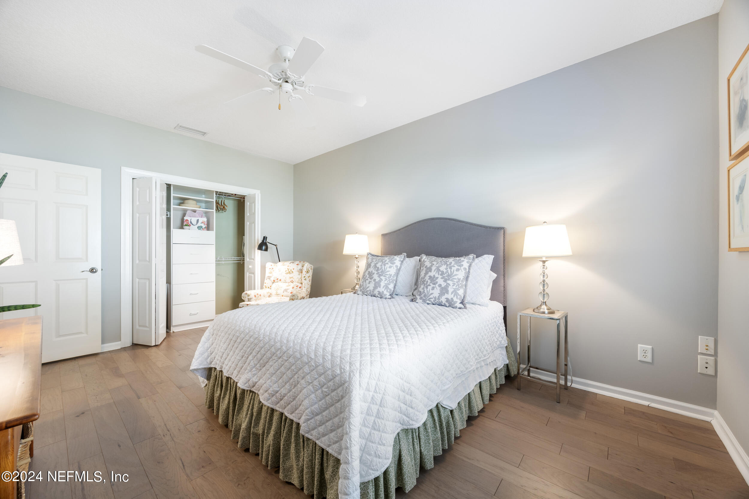348 Fiddlers Point Drive St. Augustine, FL 32080 - Photo 30 of 58 a bedroom with a bed and a night stand