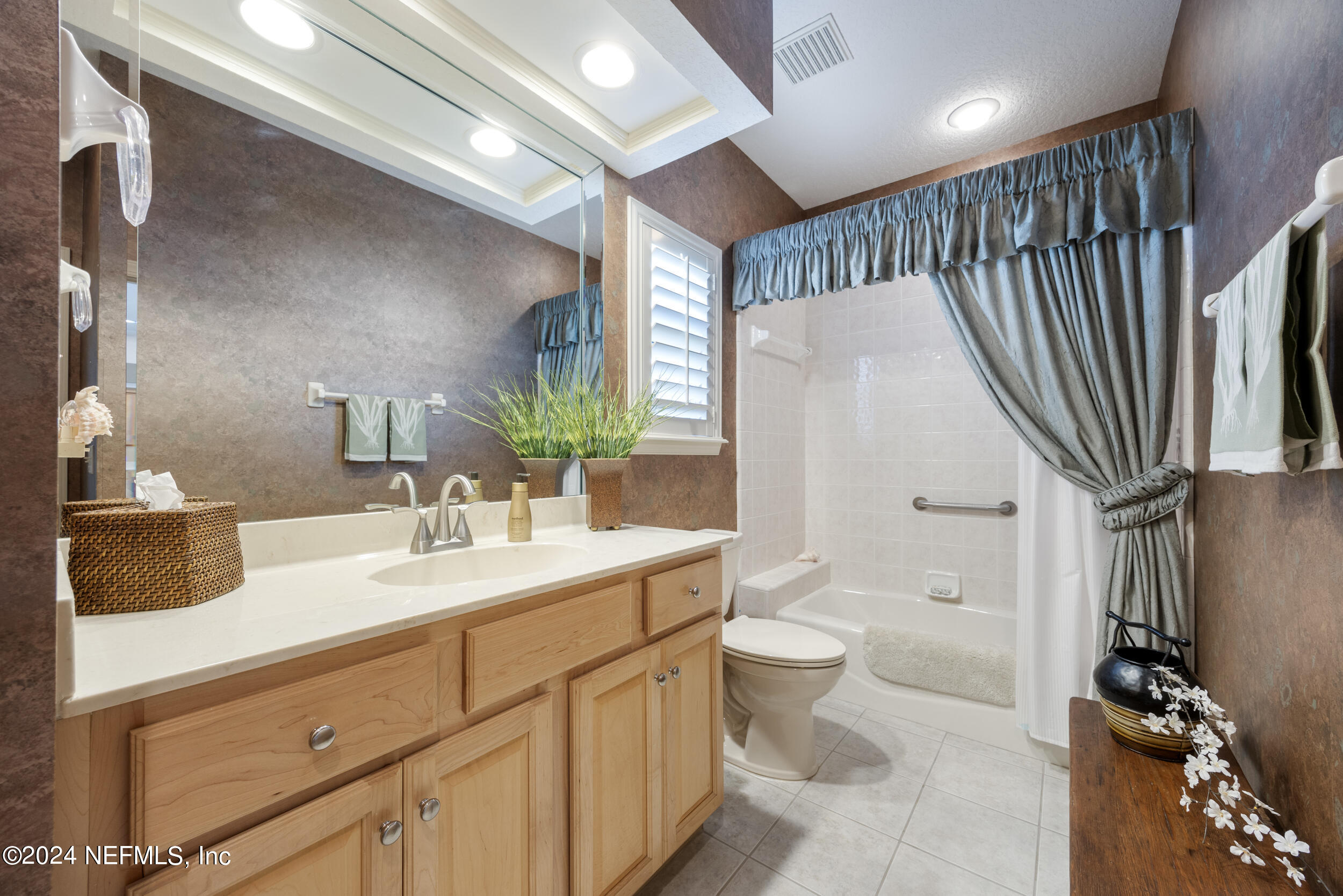 348 Fiddlers Point Drive St. Augustine, FL 32080 - Photo 31 of 58 a bathroom with a double vanity sink toilet and shower