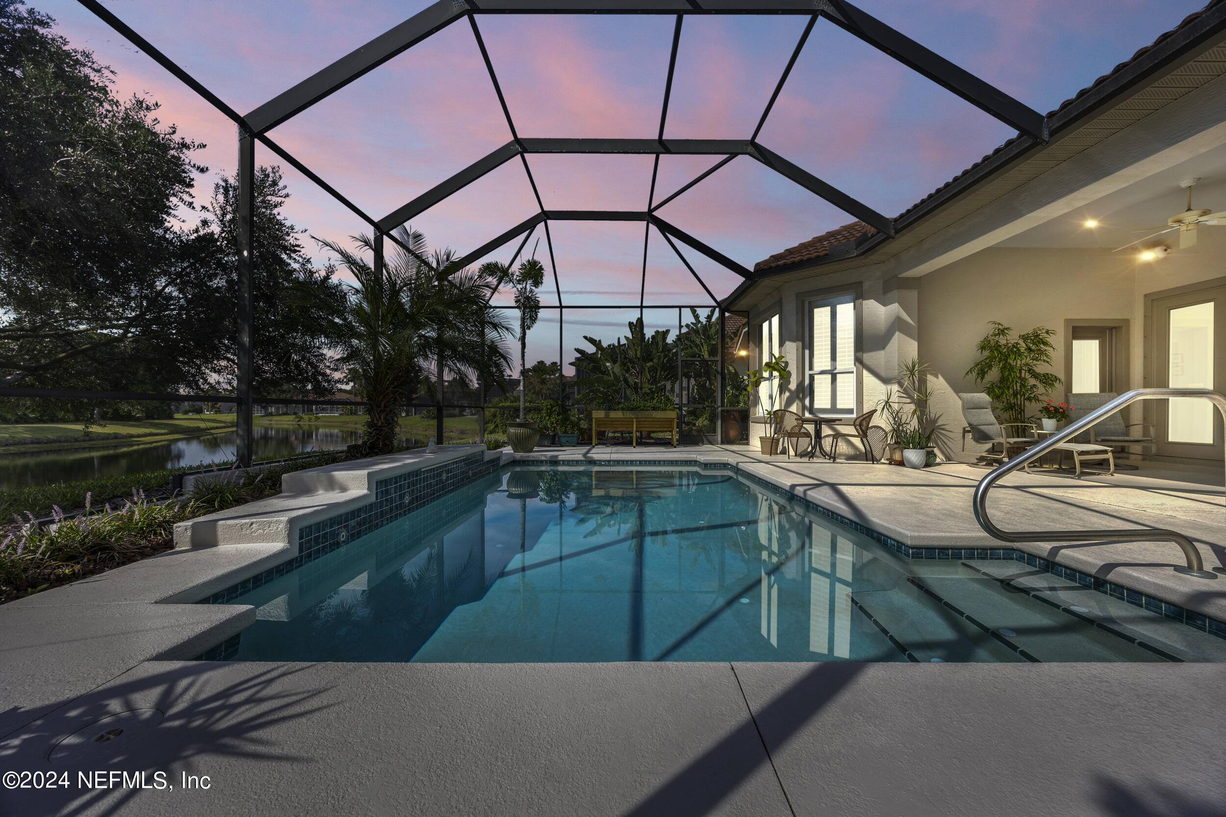 348 Fiddlers Point Drive St. Augustine, FL 32080 - Photo 37 of 58 a view of a swimming pool with a patio and a yard