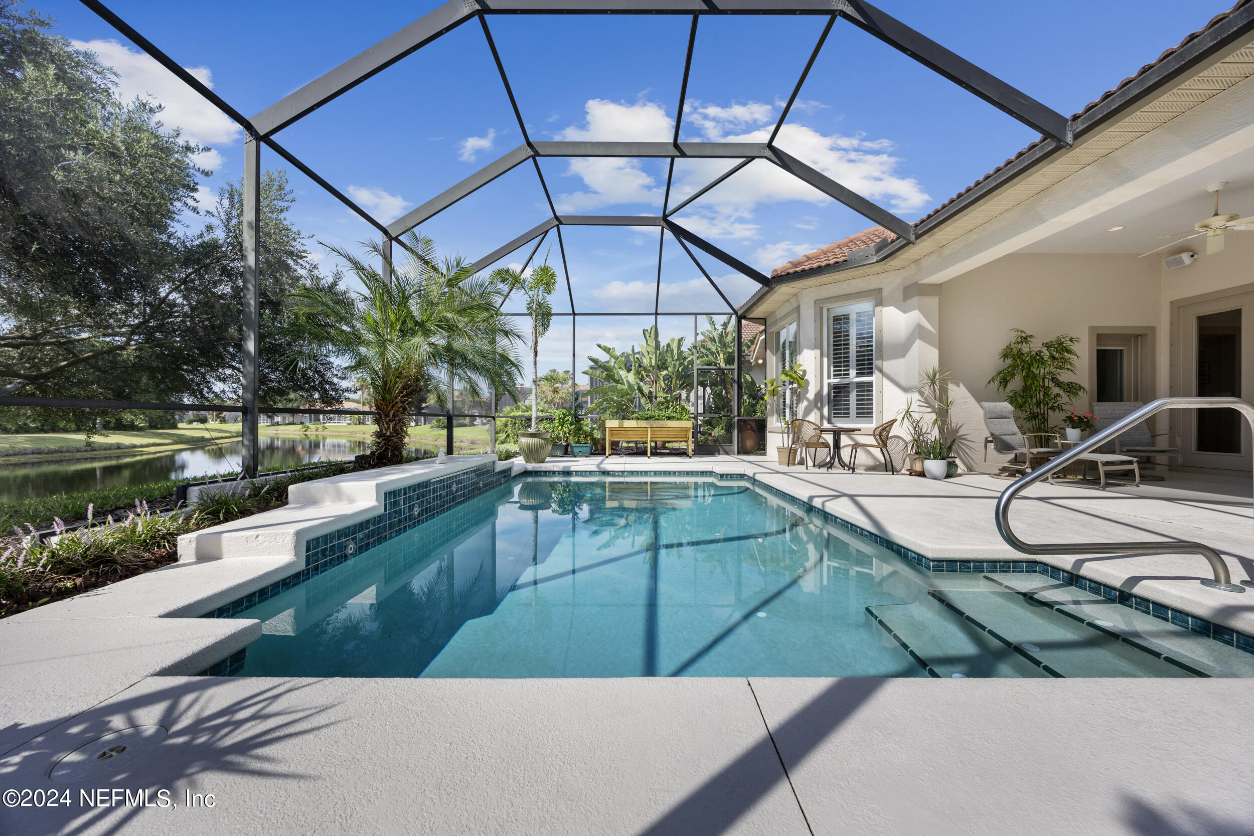 348 Fiddlers Point Drive St. Augustine, FL 32080 - Photo 38 of 58 a view of a swimming pool with a patio