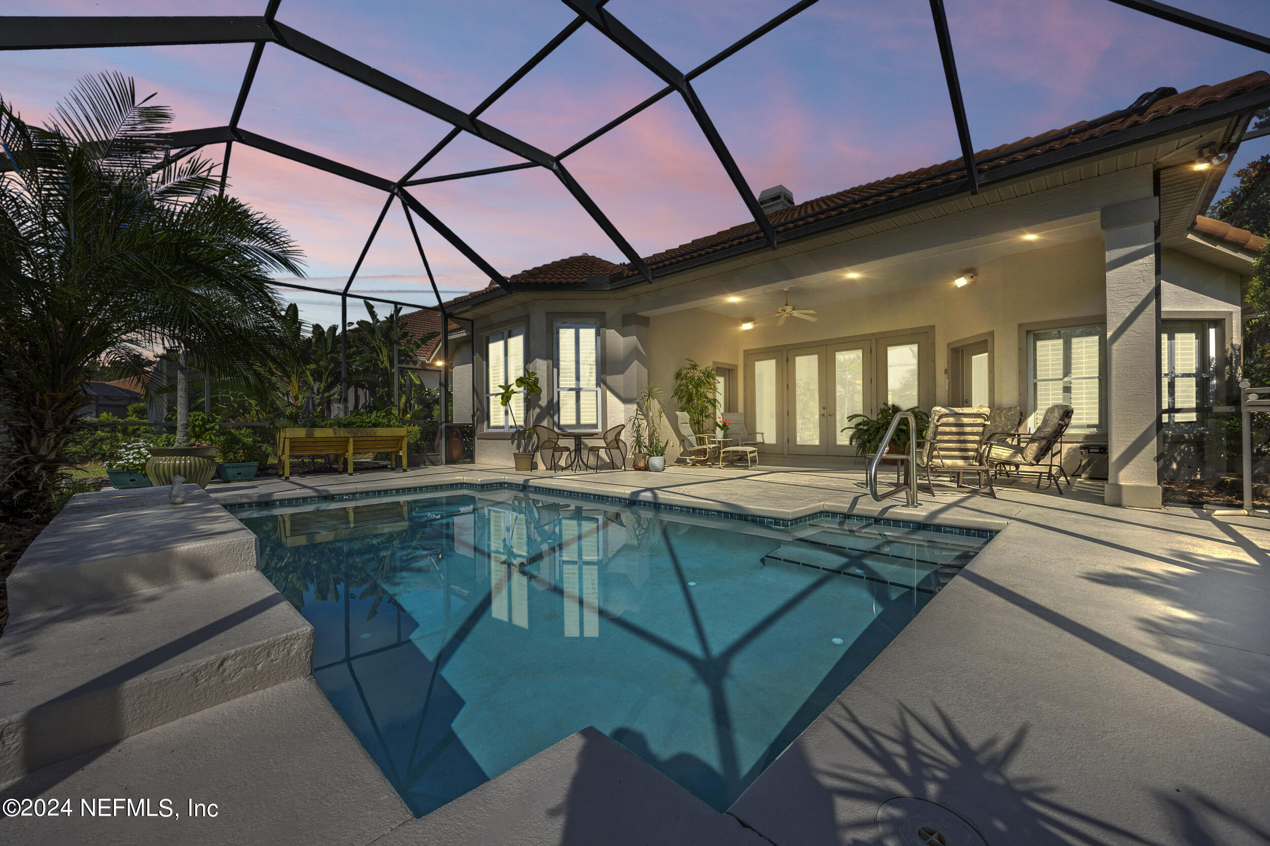 348 Fiddlers Point Drive St. Augustine, FL 32080 - Photo 39 of 58 a view of a swimming pool with a patio