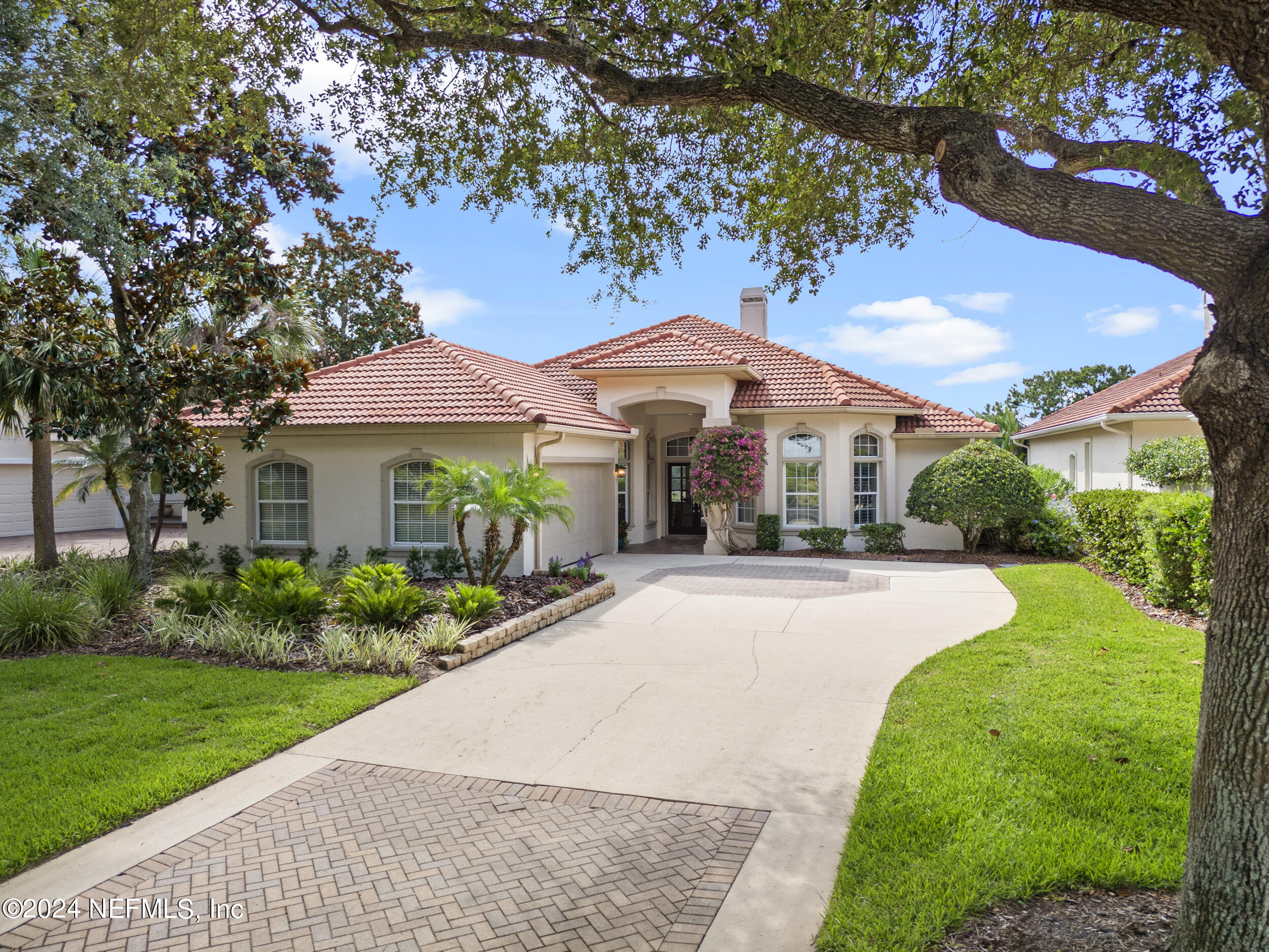 348 Fiddlers Point Drive St. Augustine, FL 32080 - Photo 41 of 58 a front view of a house with yard and green space