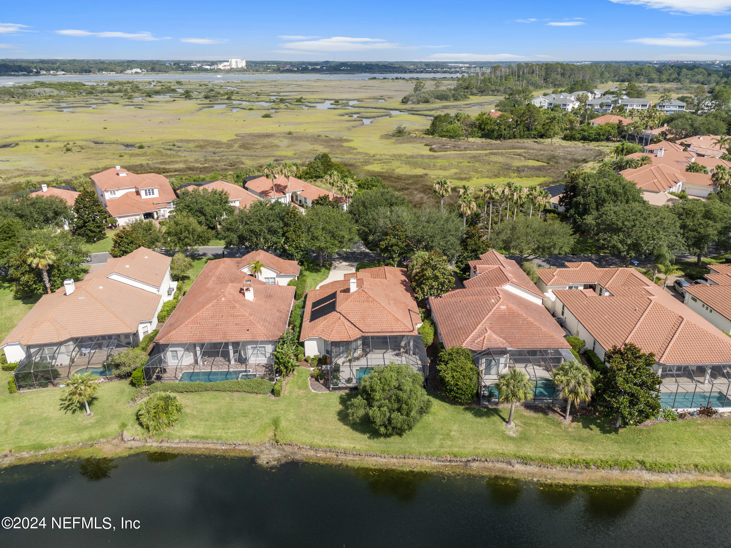 348 Fiddlers Point Drive St. Augustine, FL 32080 - Photo 45 of 58 an aerial view of a houses with a lake view